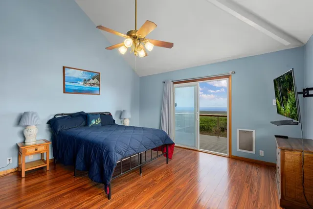 a bedroom with a bed and a view of bedroom