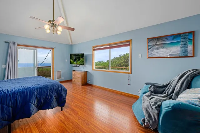 a bedroom with bed and window