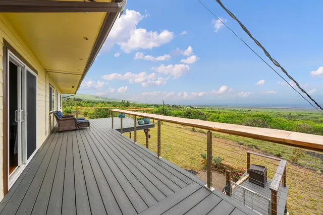 a view of balcony with wooden floor and city view