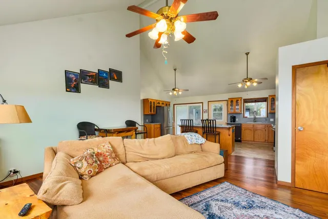 a living room with furniture and a chandelier