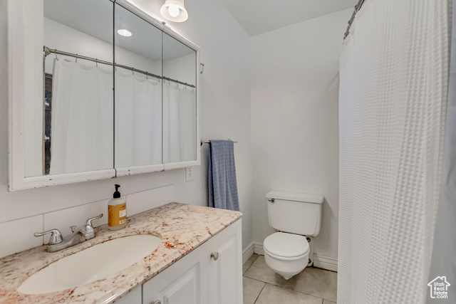 360 East Center Street Centerville, UT 84014 - Photo 18 of 41 Bathroom with vanity, light tile patterned floors, and curtained shower