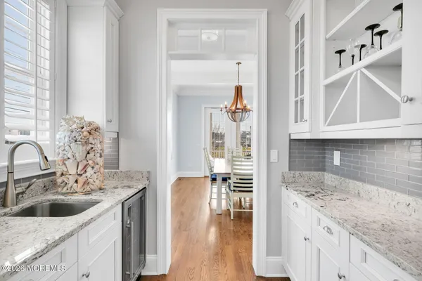 a large kitchen with stainless steel appliances granite countertop a stove a sink and a refrigerator