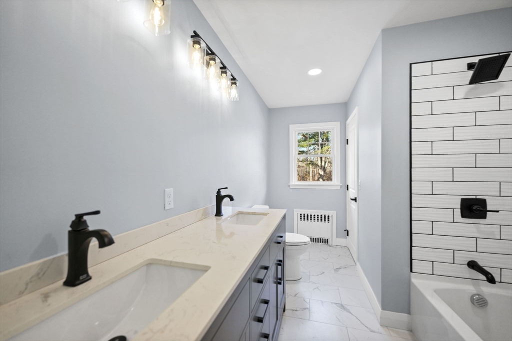 837 Main Road Westport, MA 02790 - Photo 6 of 18 a bathroom with a tub sink and mirror