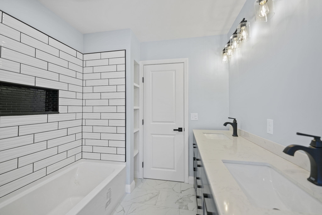 837 Main Road Westport, MA 02790 - Photo 7 of 18 a bathroom with a bathtub and a shower