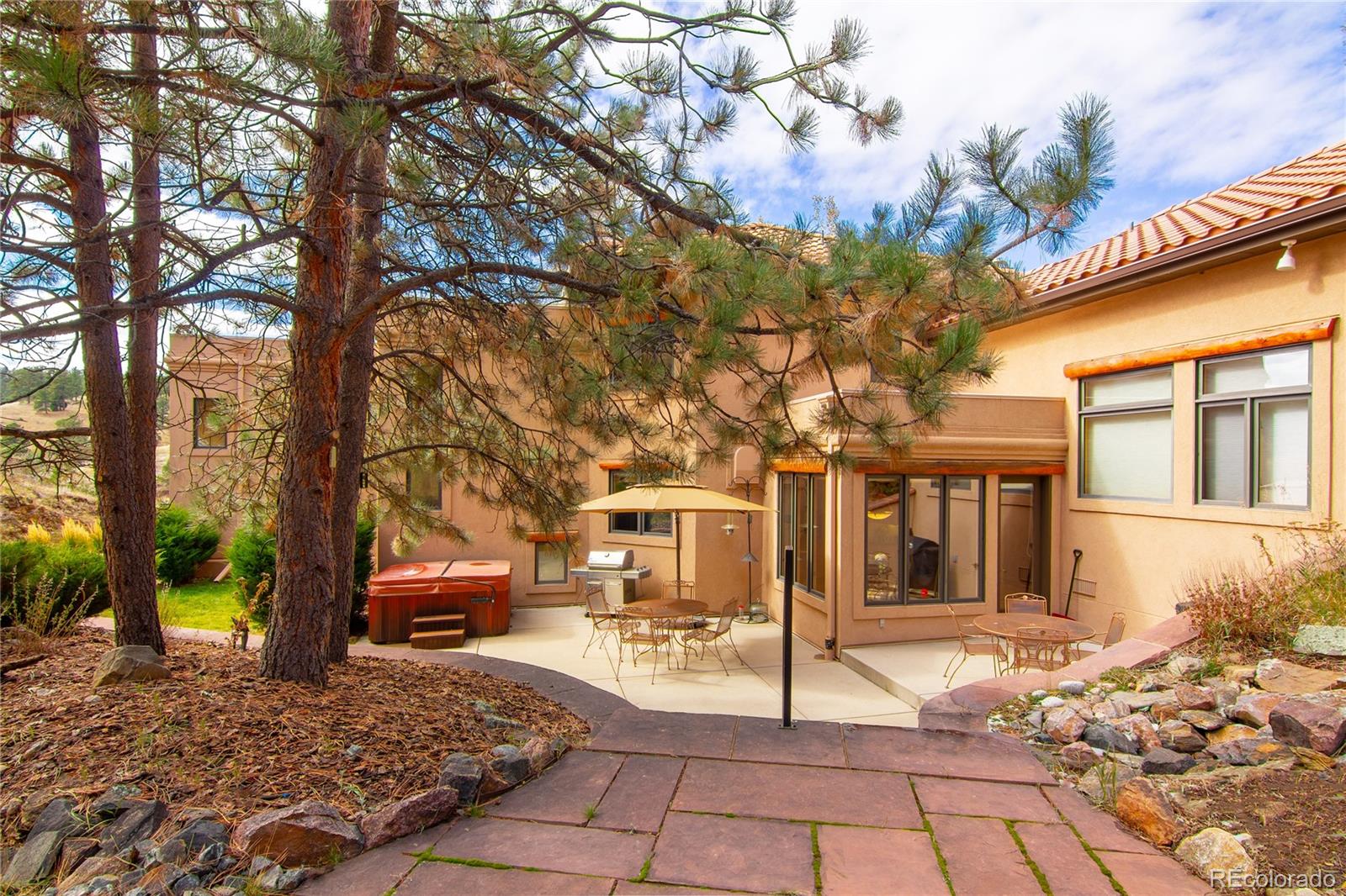 974 Spring Ranch Drive Golden, CO 80401 - Photo 30 of 35 a view of a house with a tree