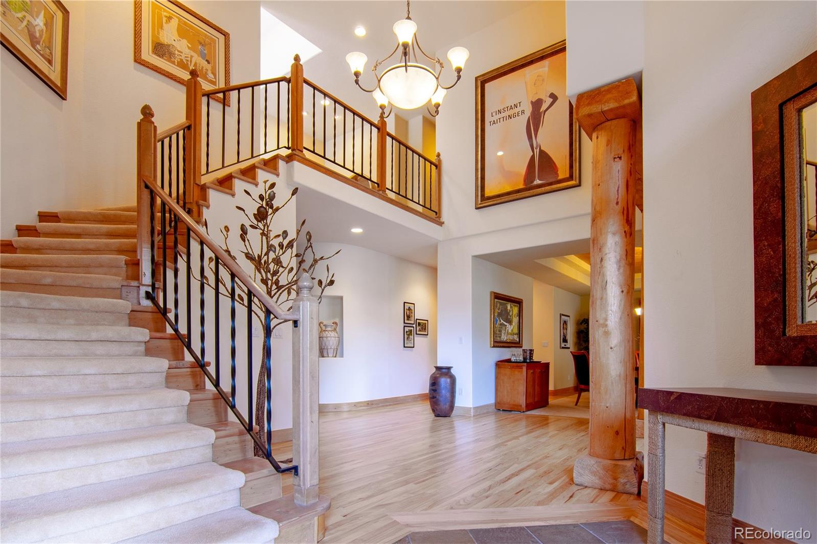 974 Spring Ranch Drive Golden, CO 80401 - Photo 5 of 35 a view of entryway and hall with wooden floor