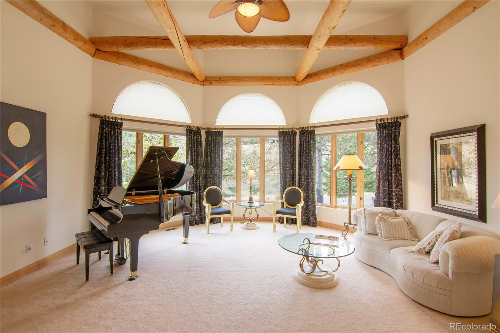 974 Spring Ranch Drive Golden, CO 80401 - Photo 6 of 35 a living room with patio furniture and a large window