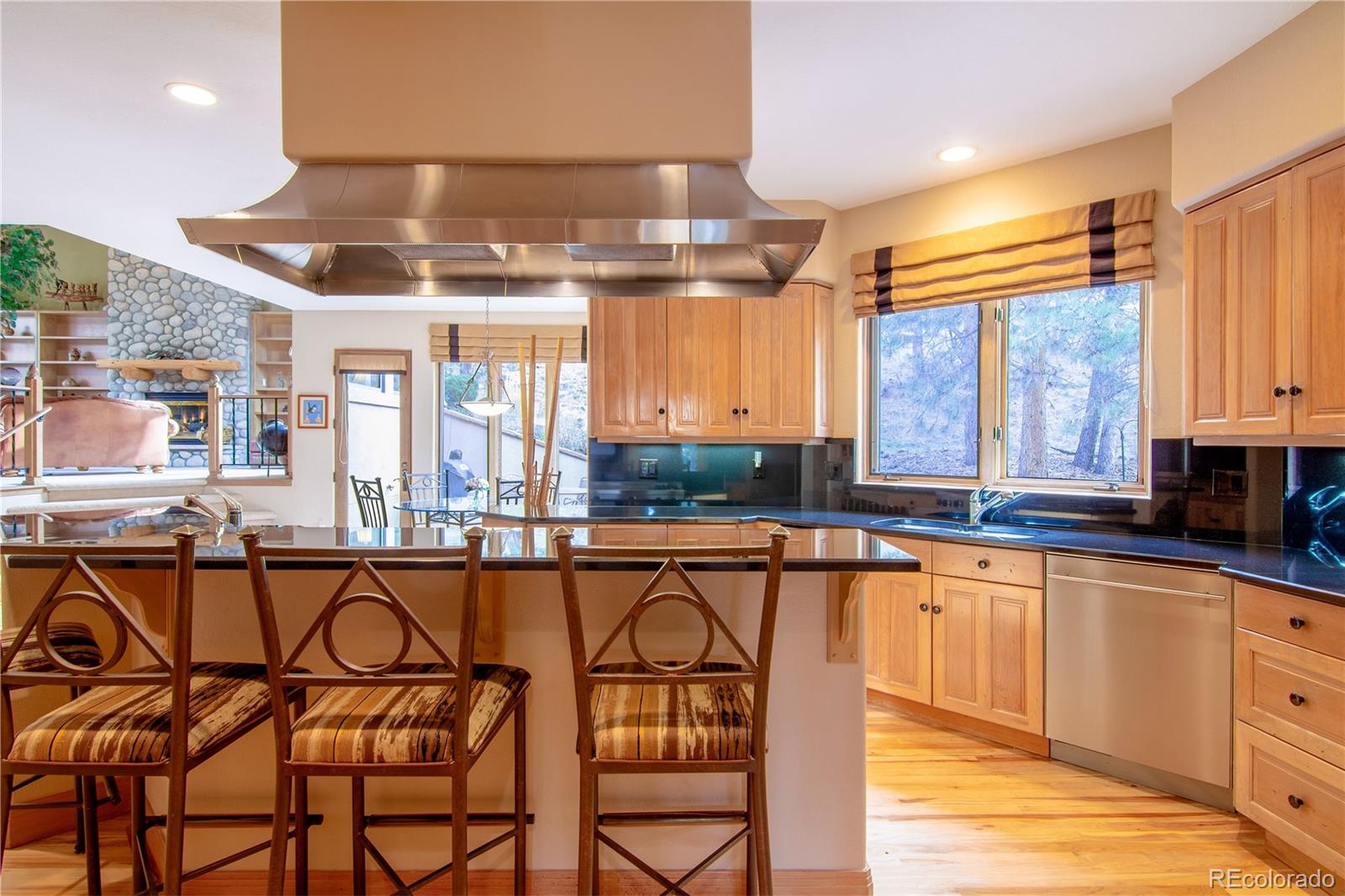 974 Spring Ranch Drive Golden, CO 80401 - Photo 9 of 35 a large kitchen with a table and chairs