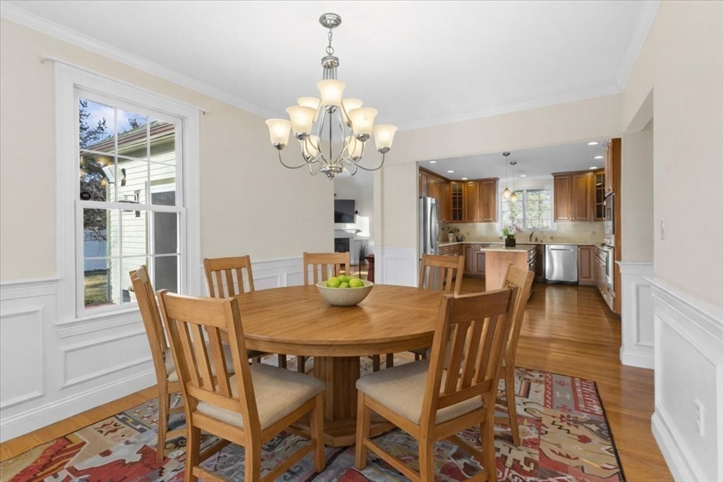 11 Shirley Road Needham, MA 02494 - Photo 12 of 41 a view of a dining room with furniture a chandelier and wooden floor