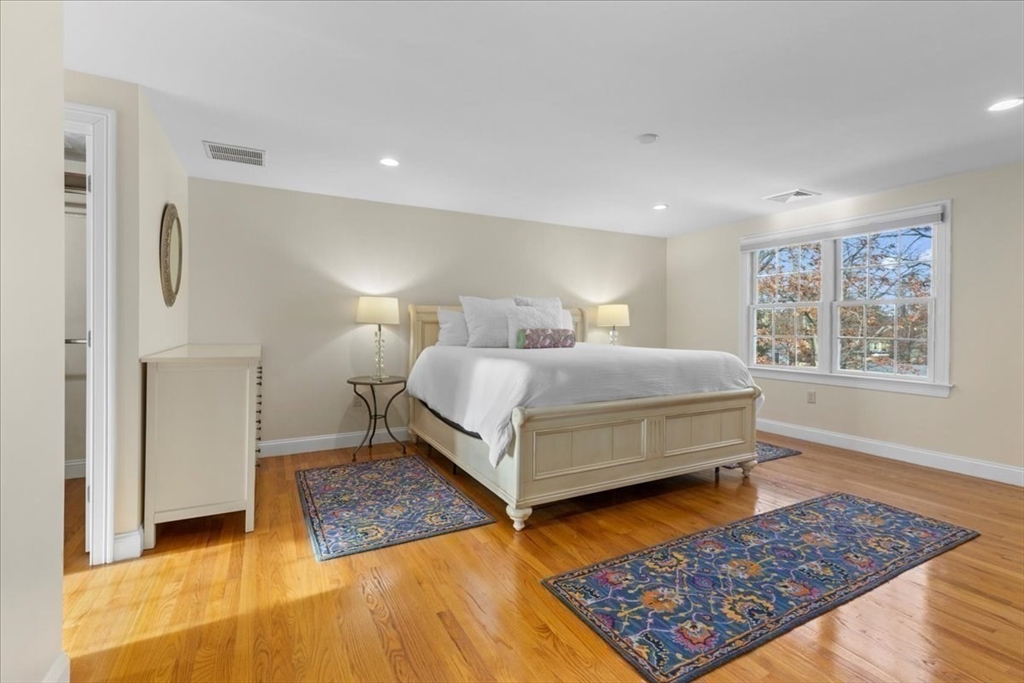 11 Shirley Road Needham, MA 02494 - Photo 25 of 41 a bedroom with a bed rug and wooden floor