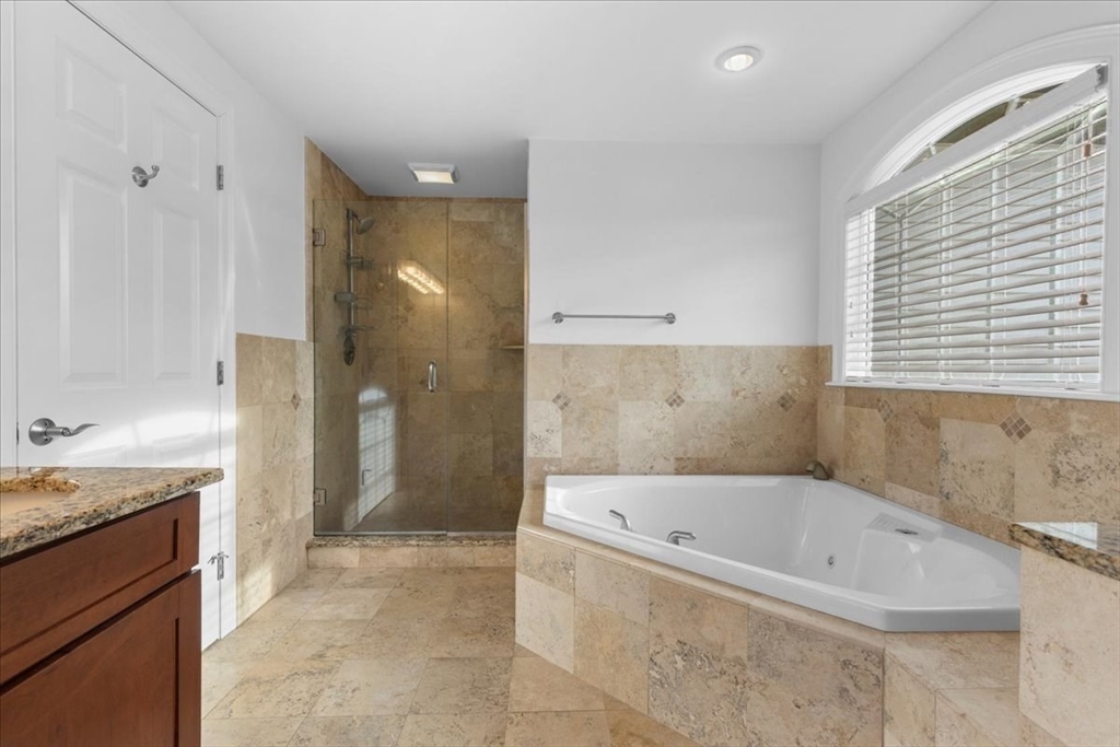 11 Shirley Road Needham, MA 02494 - Photo 28 of 41 a bathroom with a bathtub and a sink