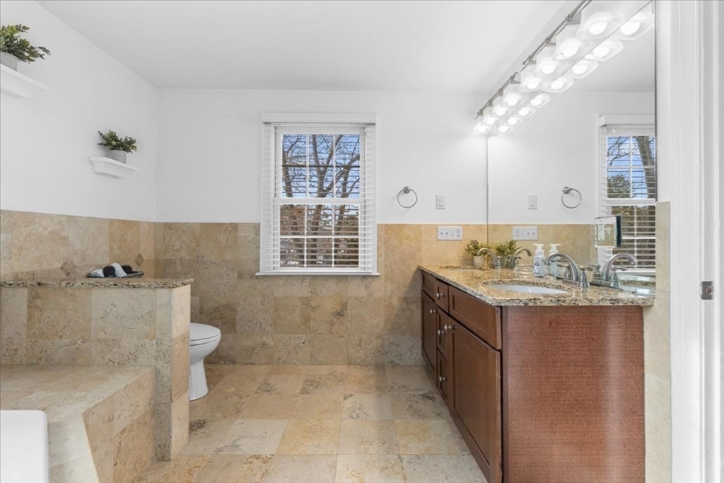 11 Shirley Road Needham, MA 02494 - Photo 29 of 41 a bathroom with a granite countertop sink and a toilet