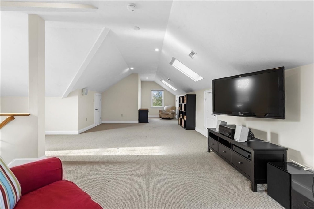 11 Shirley Road Needham, MA 02494 - Photo 30 of 41 a living room with furniture and a flat screen tv