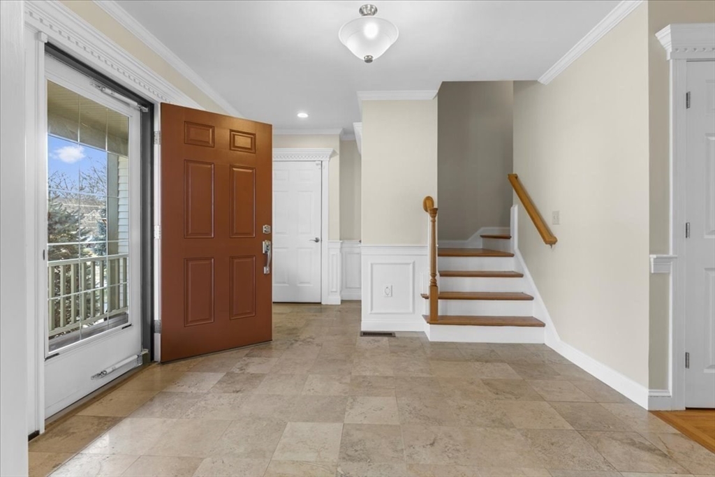 11 Shirley Road Needham, MA 02494 - Photo 4 of 41 a view of entryway with wooden floor and stairs