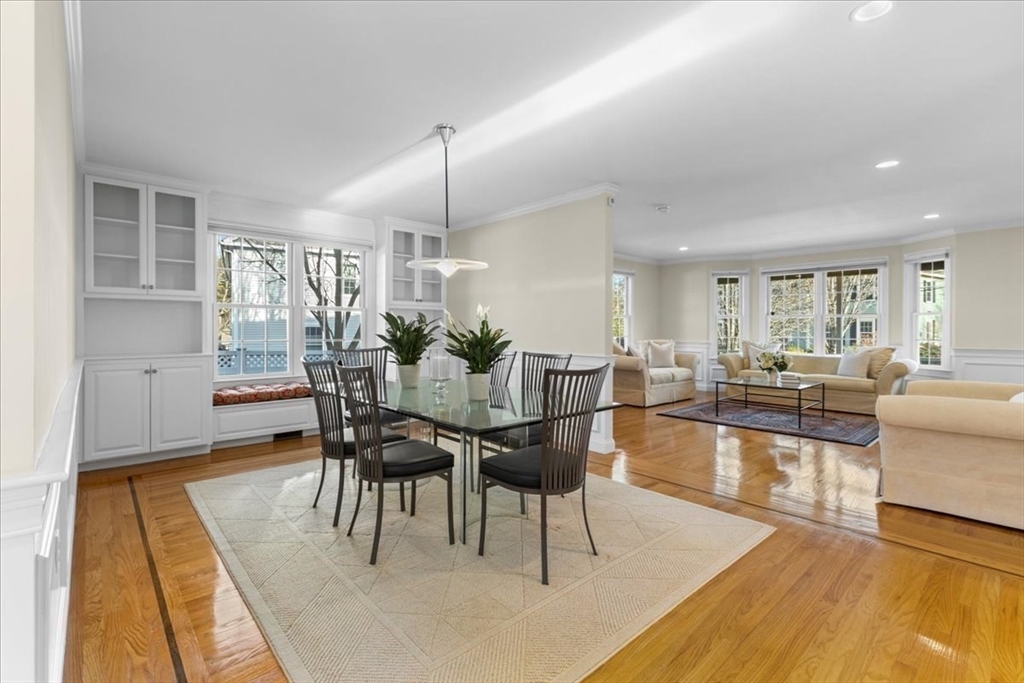 11 Shirley Road Needham, MA 02494 - Photo 8 of 41 a dining room with furniture a rug a potted plant and a painting