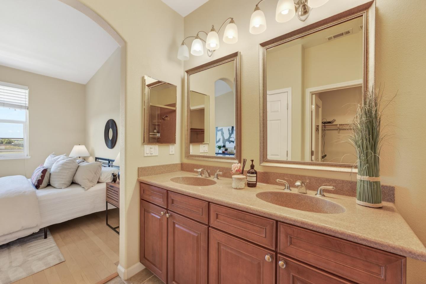 1030 Luz Del Sol Tr Loop Milpitas, CA 95035 - Photo 14 of 26 a en suite bathroom with double sink and a mirror