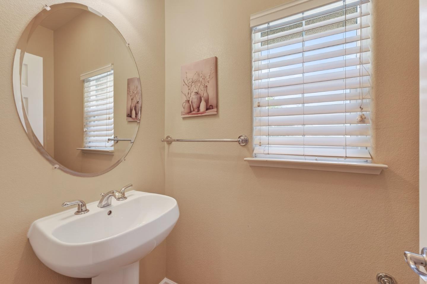 1030 Luz Del Sol Tr Loop Milpitas, CA 95035 - Photo 16 of 26 a bathroom with a sink and a mirror