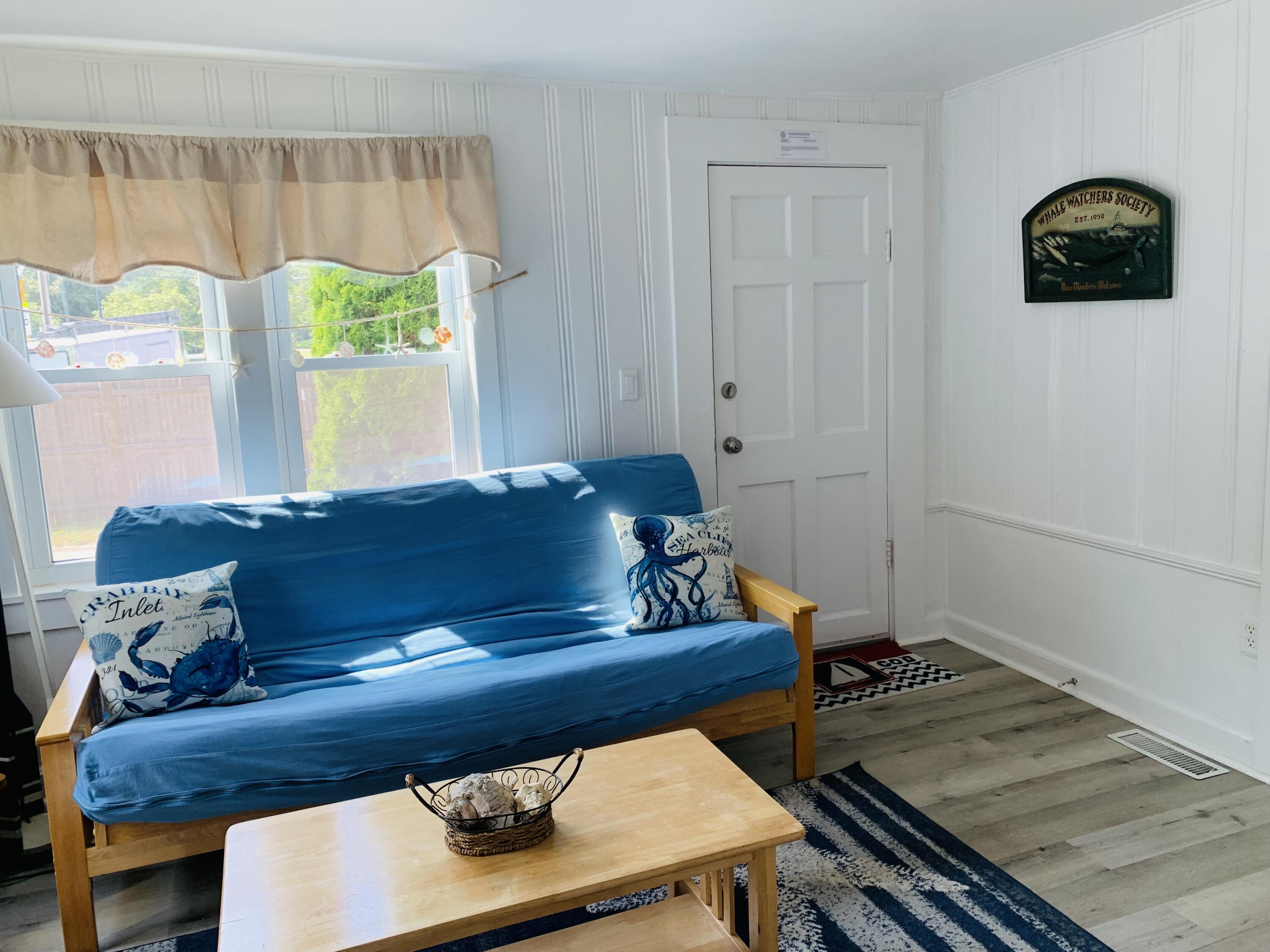 120 Bearses Way Hyannis, MA 02601 - Photo 5 of 11 a living room with furniture and a window