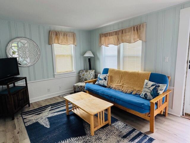 120 Bearses Way Hyannis, MA 02601 - Photo 6 of 11 a living room with furniture a rug and a window