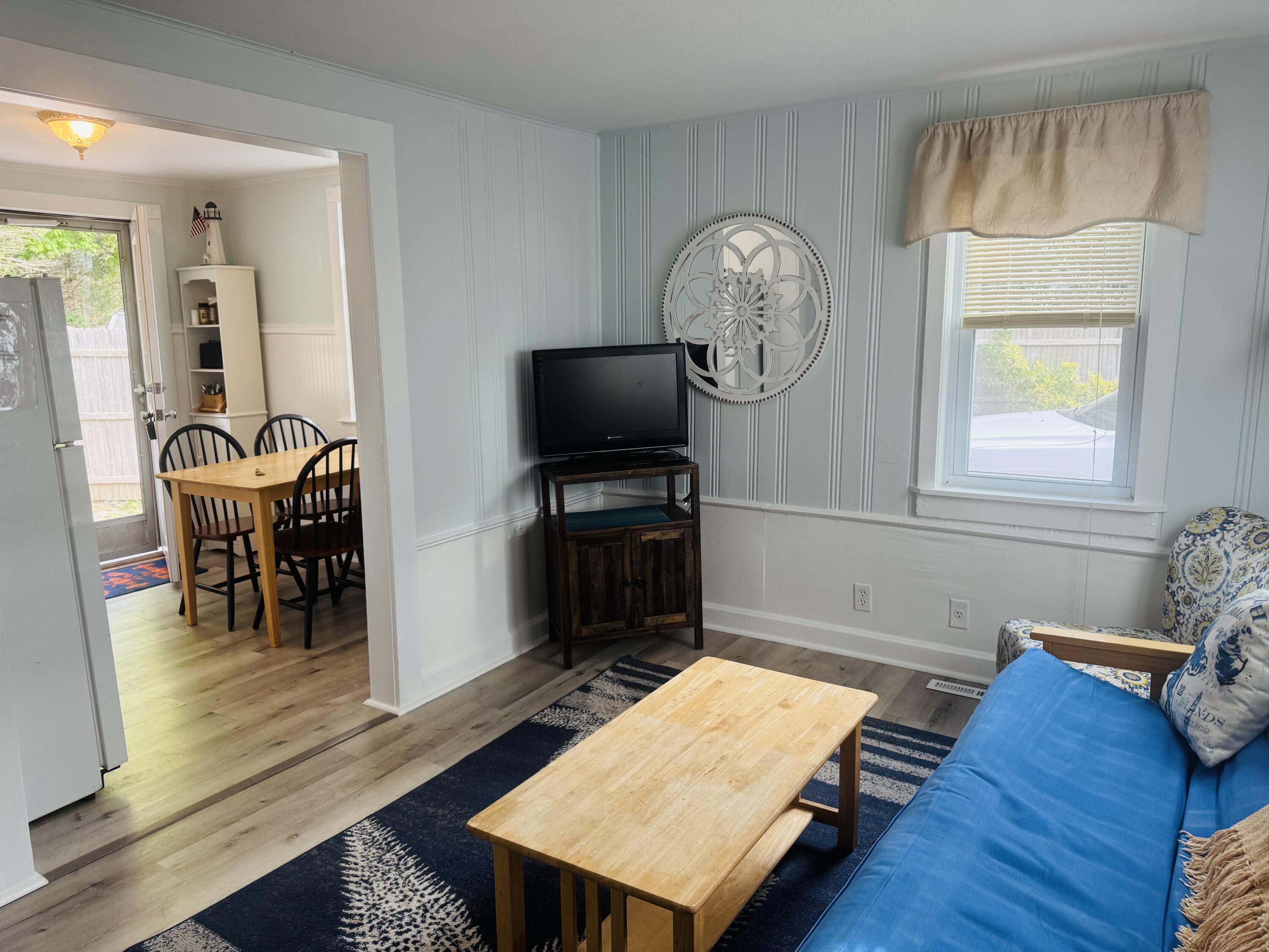 120 Bearses Way Hyannis, MA 02601 - Photo 7 of 11 a living room with furniture and a flat screen tv