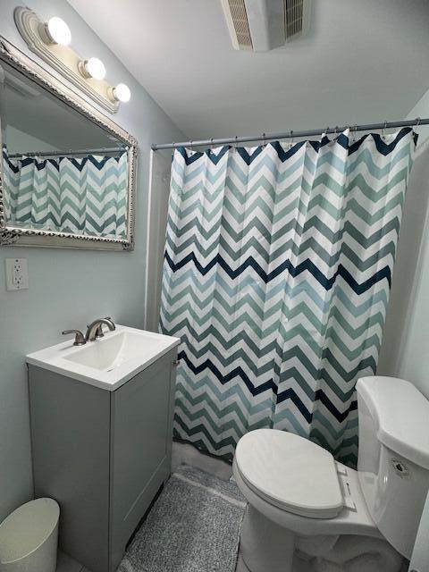 120 Bearses Way Hyannis, MA 02601 - Photo 9 of 11 a bathroom with a toilet sink and mirror
