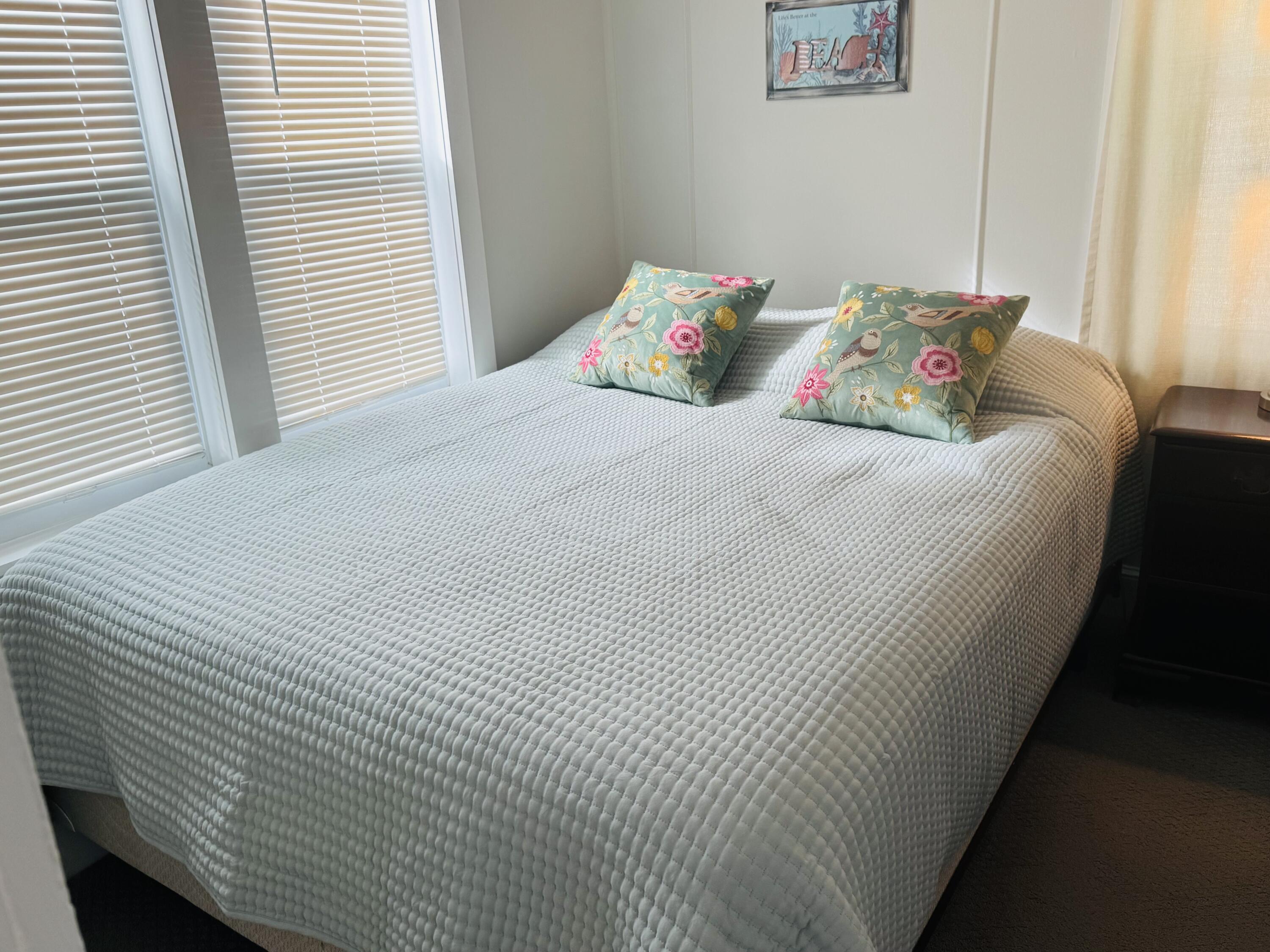 120 Bearses Way Hyannis, MA 02601 - Photo 10 of 11 a bed sitting in a bedroom next to a window
