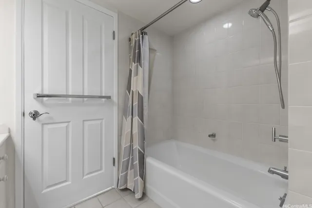 a bathroom with a bathtub a toilet and a shower