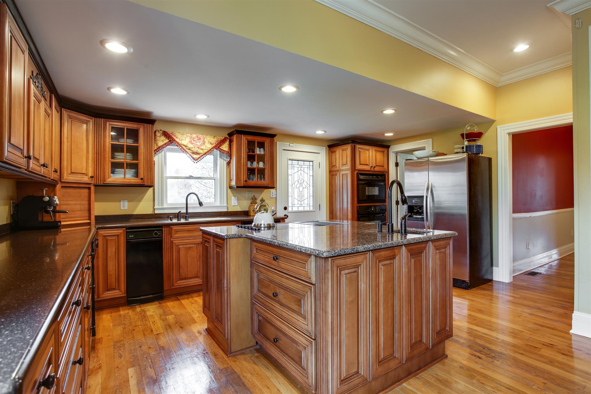 3887 Raleigh-Elam Road Santa Fe, TN 38482 - Photo 11 of 27 The Seamlessly Updated Kitchen includes a JennAire Gas Range with Additional Grill Attachment, Trash Compactor & Stainless Fridge