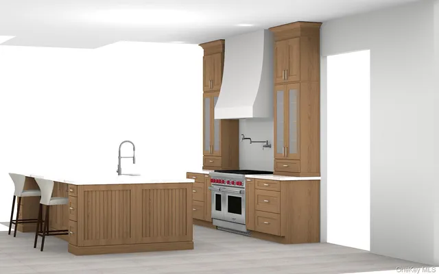 a room with kitchen island stainless steel appliances a stove and a refrigerator