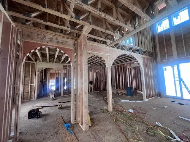 a view of a hallway with wooden floors