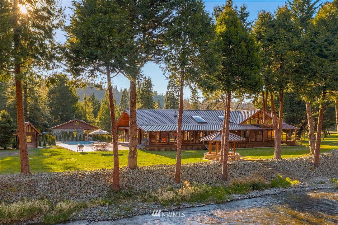 18700 Byers Road Southeast Maple Valley, WA 98038 - Photo 1 of 40 a view of a house with backyard and swimming pool