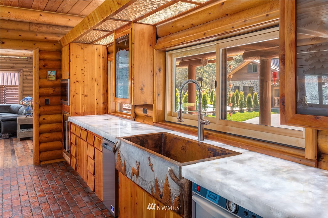 18700 Byers Road Southeast Maple Valley, WA 98038 - Photo 14 of 40 a kitchen that has a sink and a large window