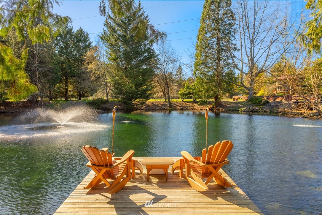 18700 Byers Road Southeast Maple Valley, WA 98038 - Photo 29 of 40 a lake view with a table and chairs