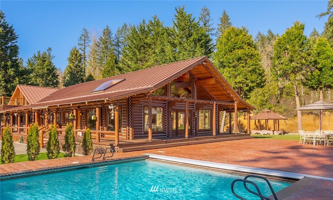 18700 Byers Road Southeast Maple Valley, WA 98038 - Photo 3 of 40 a view of a house with wooden deck and a backyard