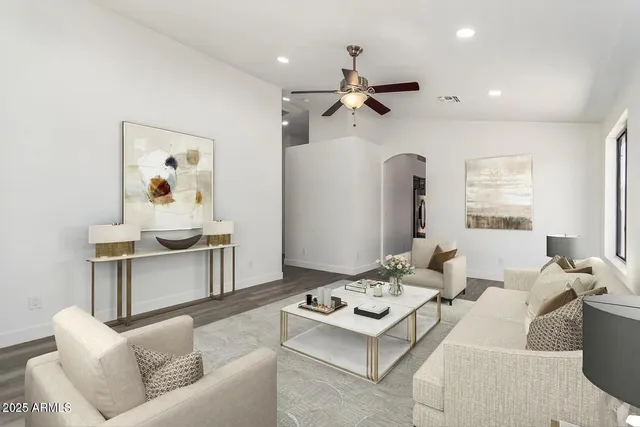 a living room with furniture and a table