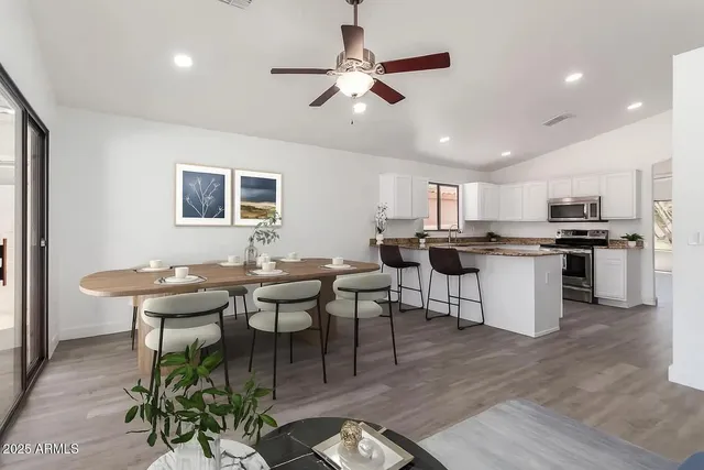 a view of a dining room with furniture