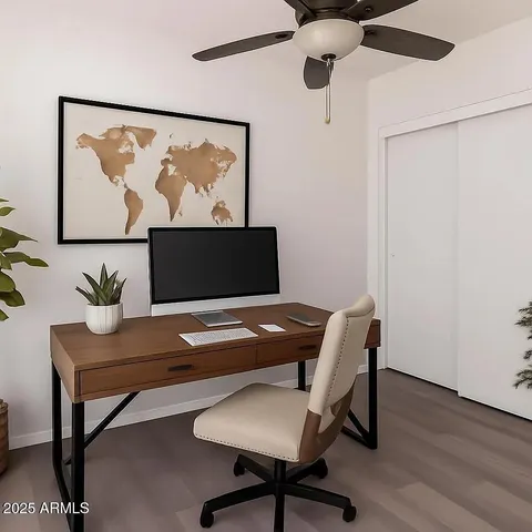 a workspace with furniture and wooden floor