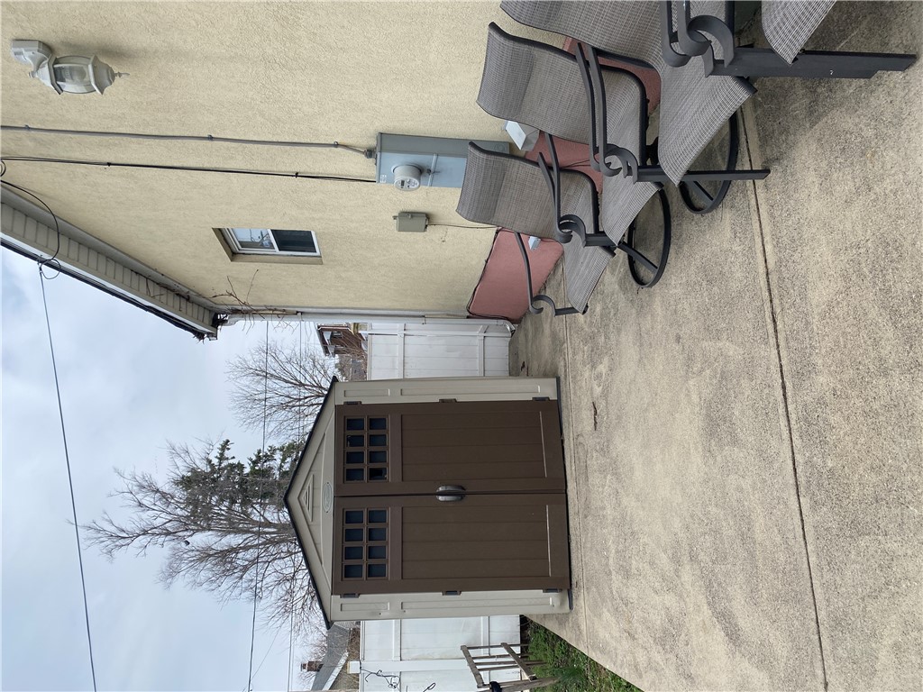 175 Rita Street Dayton, OH 45404 - Photo 46 of 48 This paved outdoor space features convenient storage and an accessible side entrance.