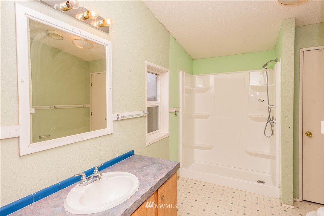 268 Sareault Road Toledo, WA 98591 - Photo 15 of 25 a bathroom with a sink toilet and shower