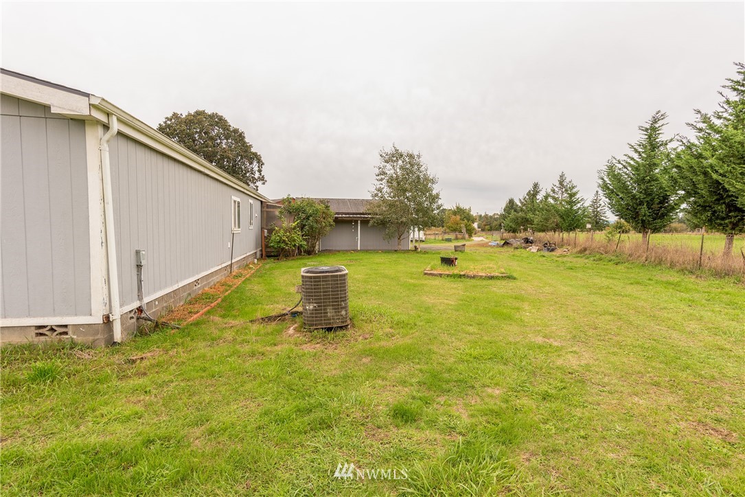 268 Sareault Road Toledo, WA 98591 - Photo 16 of 25 a view of a swimming pool with an outdoor space and seating area