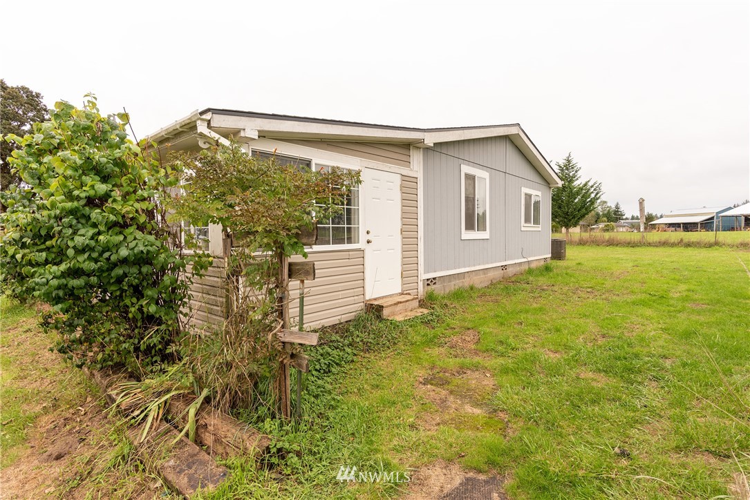 268 Sareault Road Toledo, WA 98591 - Photo 4 of 25 a house view with a backyard space