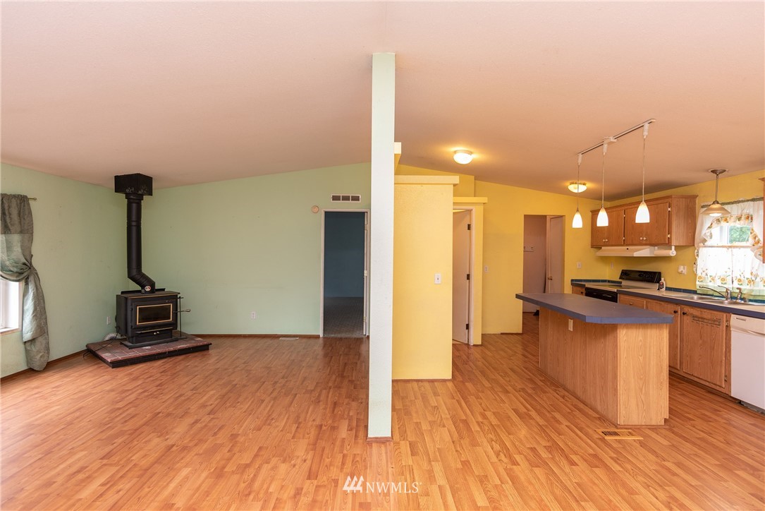 268 Sareault Road Toledo, WA 98591 - Photo 7 of 25 a view of a living room hardwood floor and kitchen