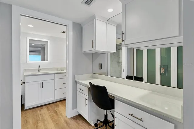 a room with kitchen island a sink a stove and a window