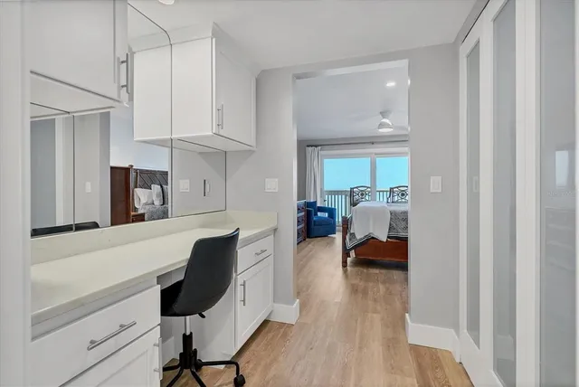 a bedroom with furniture and a chandelier