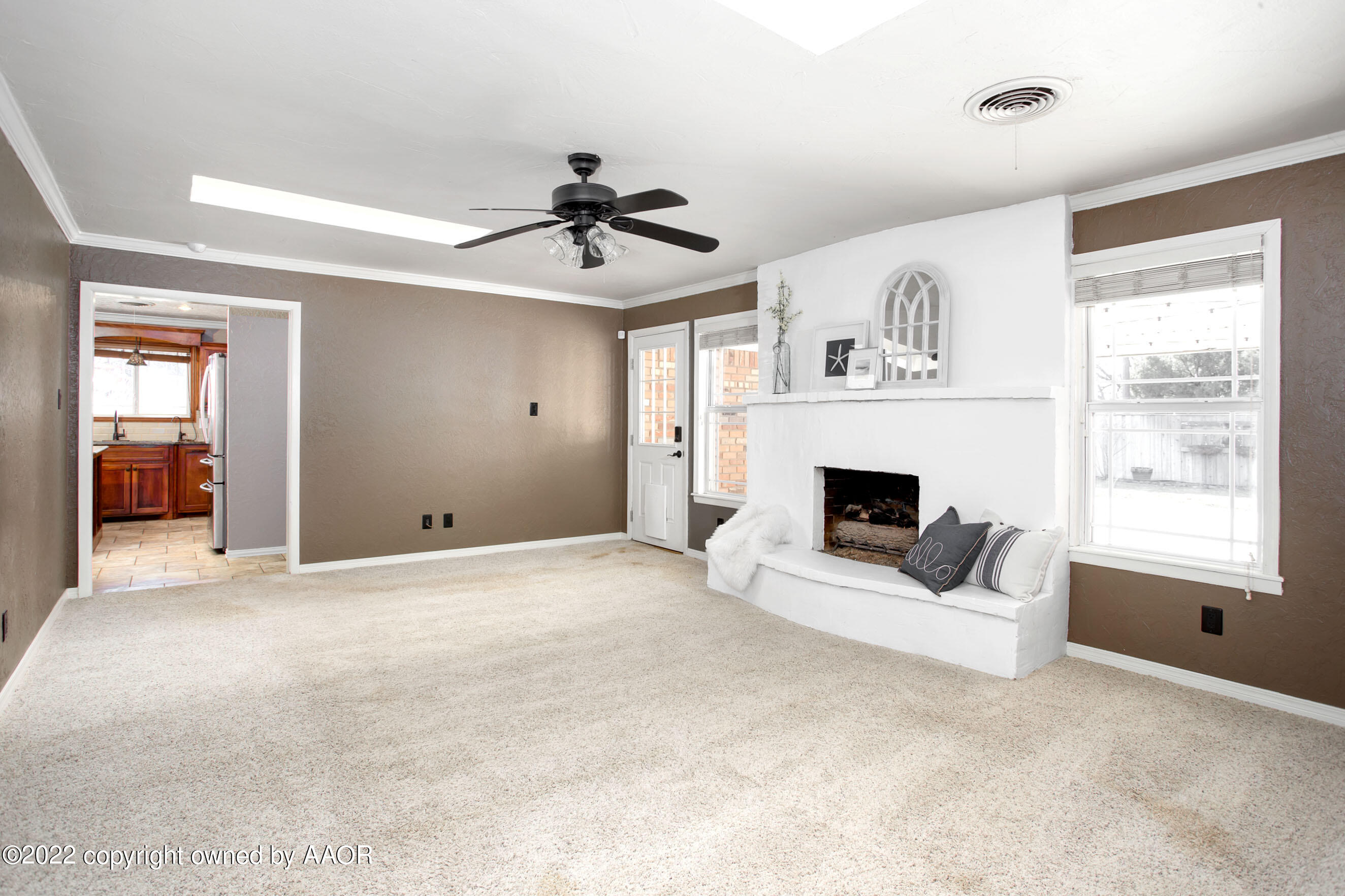 6301 Dreyfuss Road Amarillo, TX 79106 - Photo 6 of 34 a view of a livingroom with a fireplace window and wooden floor