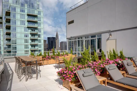 a group of people sitting in front of a building
