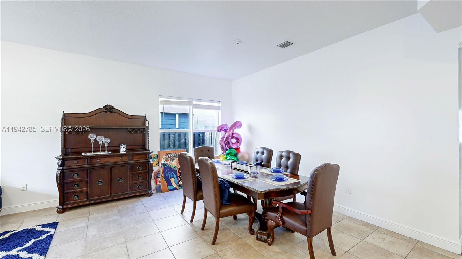 231 Northeast 33rd Terrace Homestead, FL 33033 - Photo 11 of 87 a view of a dining room with furniture