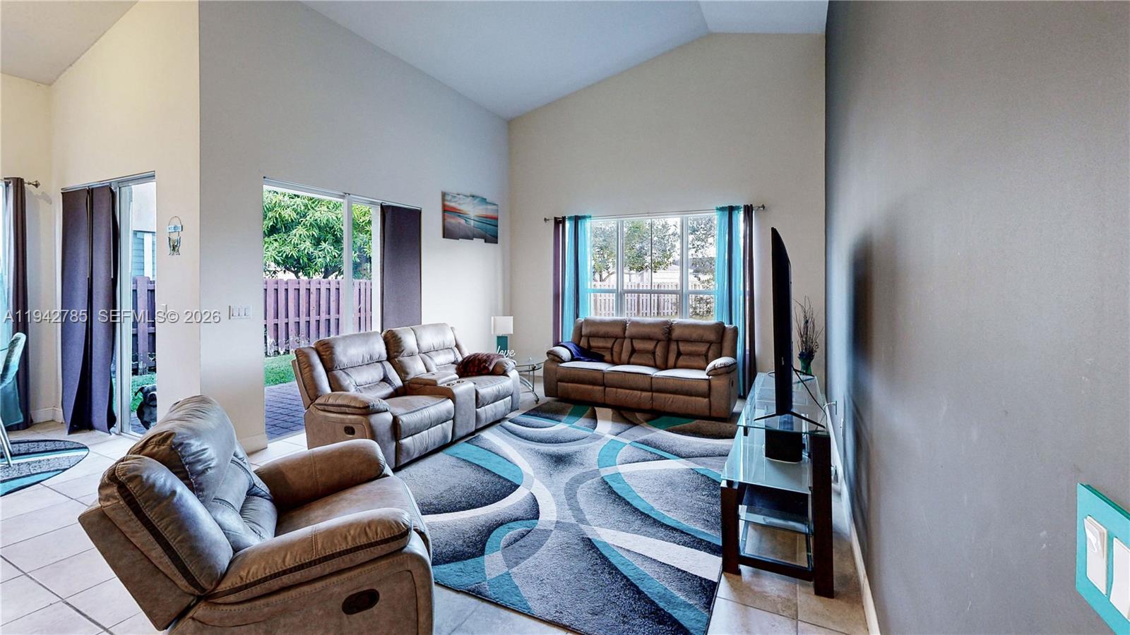 231 Northeast 33rd Terrace Homestead, FL 33033 - Photo 20 of 87 a living room with furniture and a window