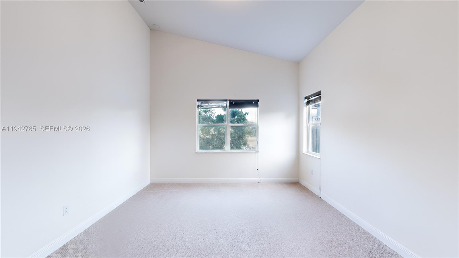 231 Northeast 33rd Terrace Homestead, FL 33033 - Photo 25 of 87 a view of an empty room with a window