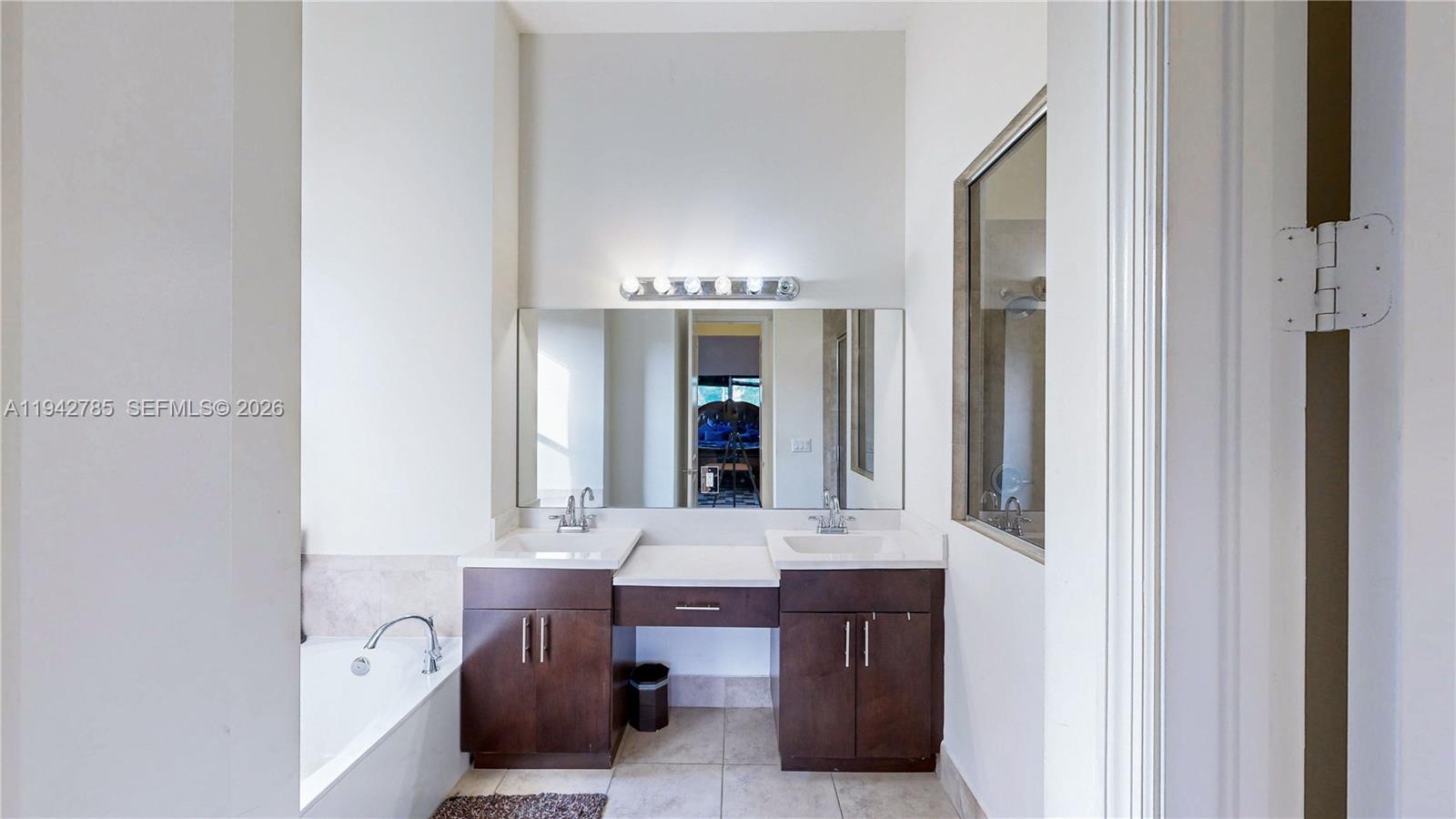231 Northeast 33rd Terrace Homestead, FL 33033 - Photo 27 of 87 a bathroom with a bathtub and a sink